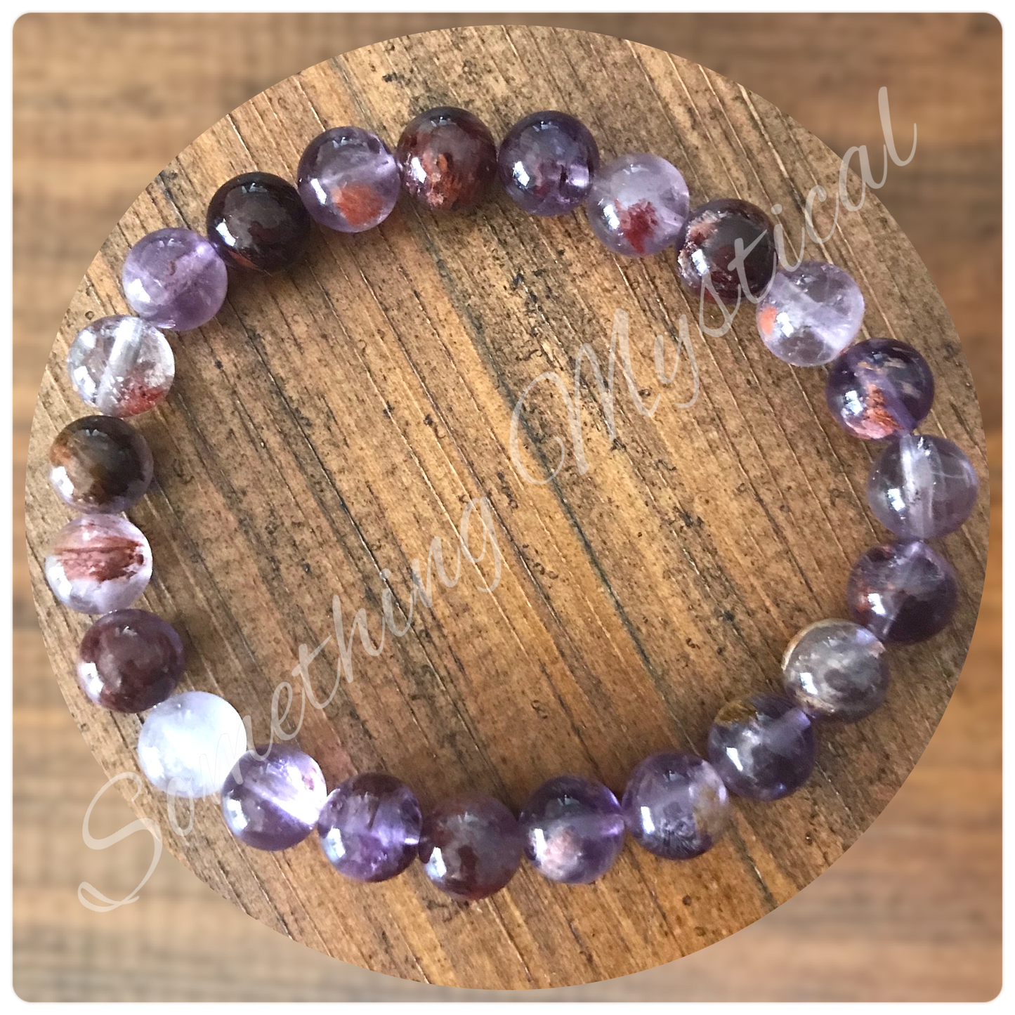 Bracelet - Super Seven Cacoxenite Amethyst - 8mm round stone